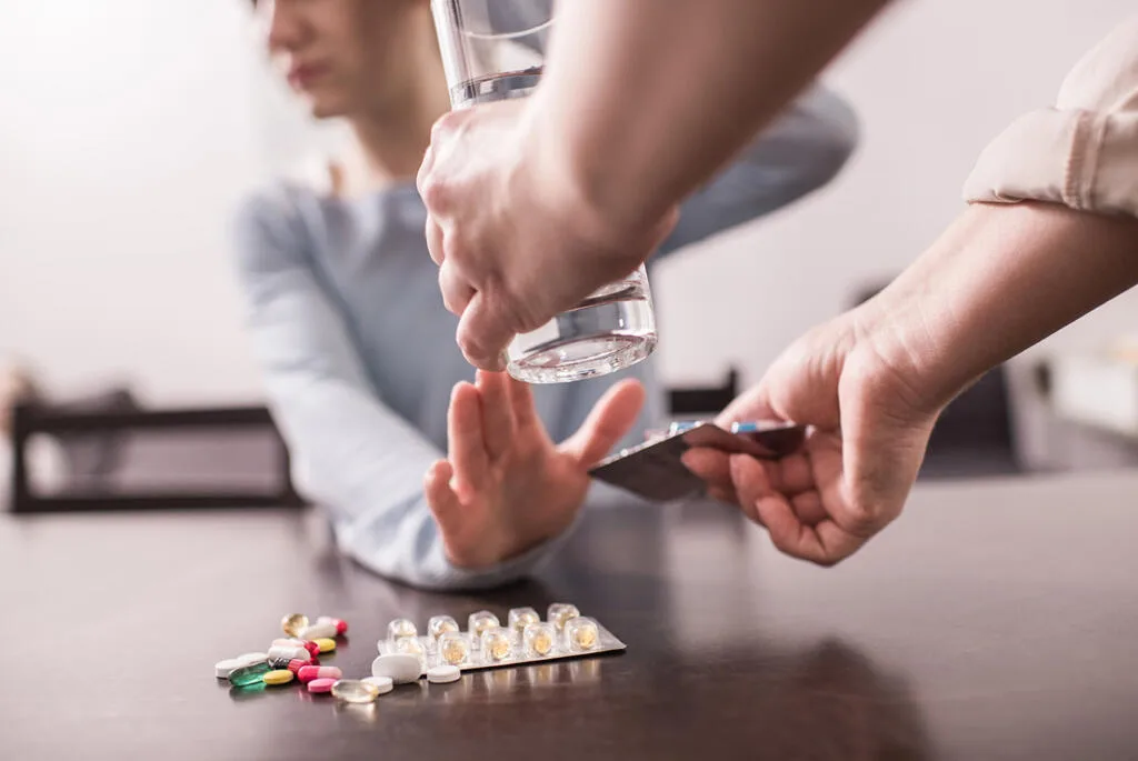Pharmacist helping a patient with supervised consumption in Huddersfield.