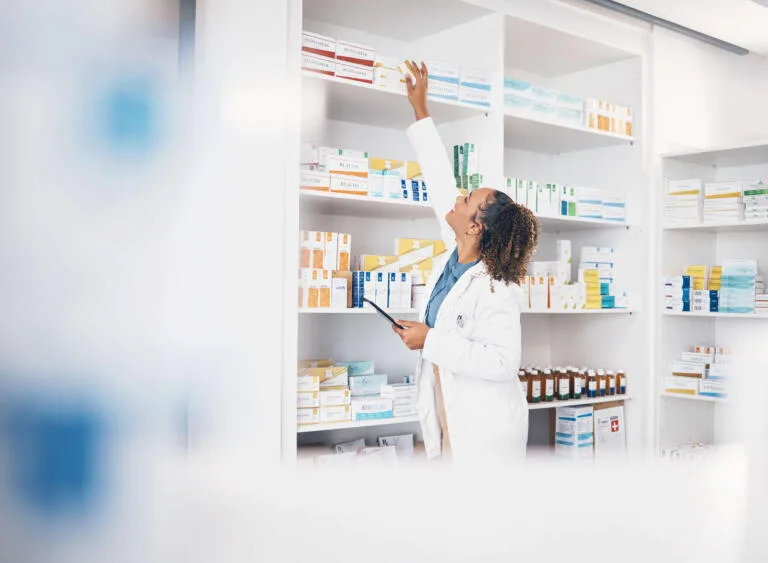 Pharmacist stacking medicine shelves at Park View Pharmacy – NHS Pharmacy in Huddersfield