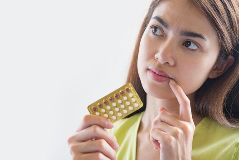 Woman holding morning after pill in Huddersfield at Park View Pharmacy.